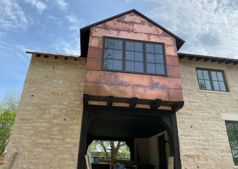 Copper metal panel facade on a stone building for Metal Roof Coating in Texas City